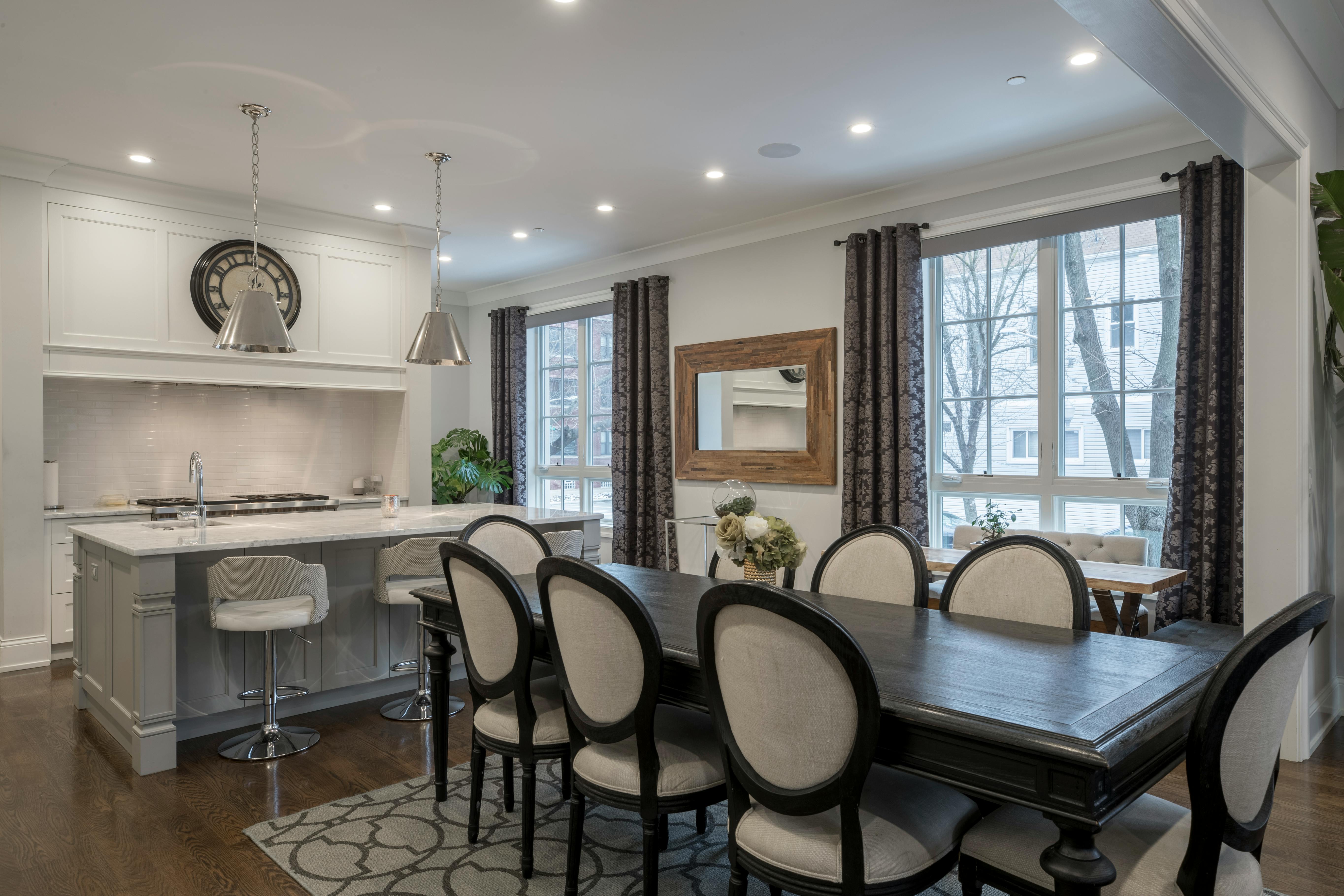 Open concept kitchen and dining room with a large dark wood table